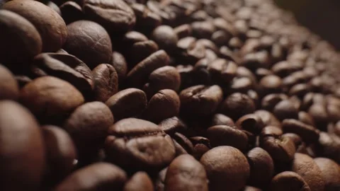 Roasted coffee beans macro shot, panorama from the right. vertical video Stock Footage 303070646