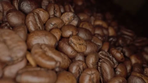 Roasted coffee beans macro shot, panorama from the right. vertical video Stock Footage 303070772