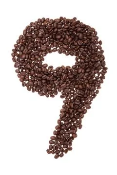 Roasted coffee beans placed in the shape of number nine Stock Photos