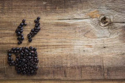 Roasted coffee beans placed in the shape of a cup 02 Stock Photos