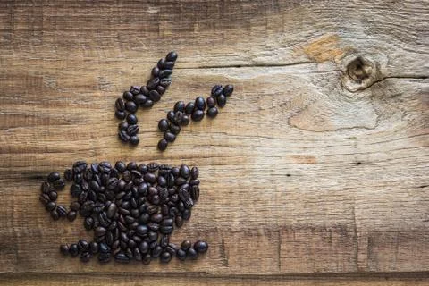 Roasted coffee beans placed in the shape of a cup 01 Stock Photos