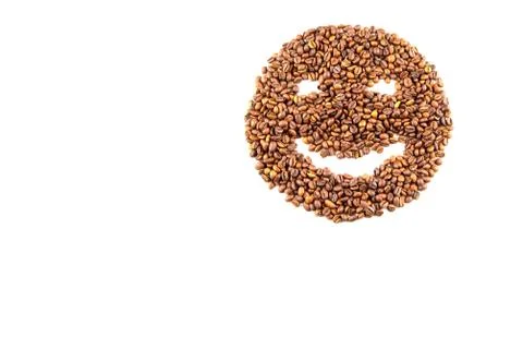 Roasted coffee beans placed in the shape of a smiling face Stock Photos
