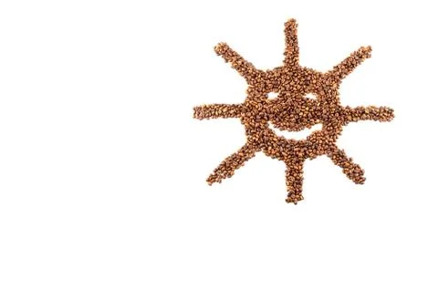 Roasted coffee beans placed in the shape of a smiling sun Stock Photos