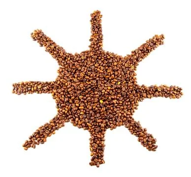 Roasted coffee beans placed in the shape of a smiling sun Stock Photos