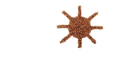 Roasted coffee beans placed in the shape of a smiling sun Stock Photos