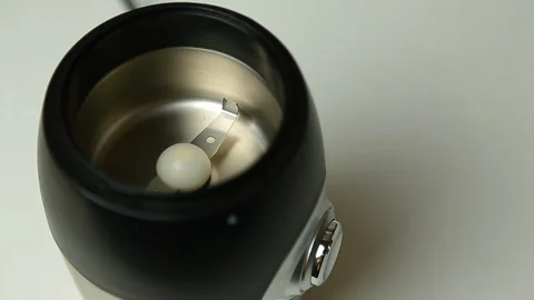 Roasted coffee beans poured into a coffee grinder, top view 스톡 동영상 126766739