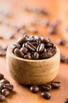 Roasted coffee beans. Roasted coffee beans in wooden bowl. Copyright: xZoo... Stock Photos