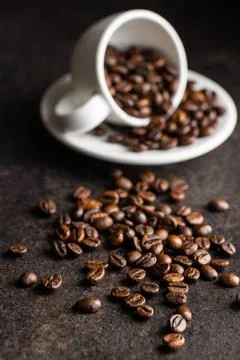 Roasted coffee beans. Roasted coffee beans on black table. Copyright: xZoo... Stock Photos