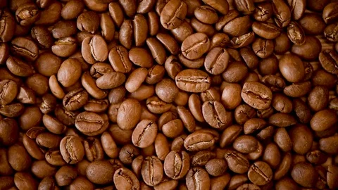 Roasted coffee beans on rorating backgound. Top view. Cappuccino, dark espresso Stock Footage 122166637