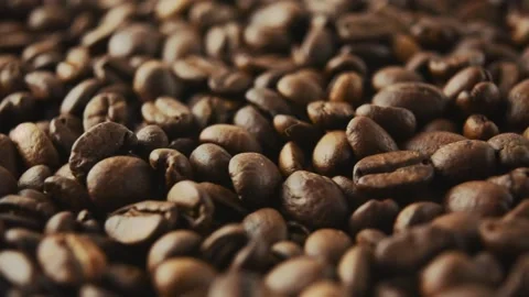 Roasted coffee beans rotate. Side view. Stock Footage 268302901