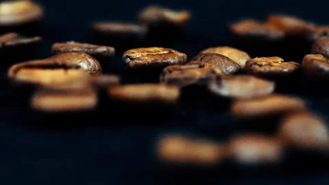 Roasted coffee beans rotating on isolated studio macro footage 4k Stock Footage 252029922