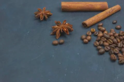 Roasted coffee beans scattering in the corner of the background. beans on a d Photos
