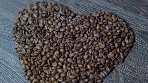 Roasted Coffee Beans Shaped as Heart Stock Footage 307711544