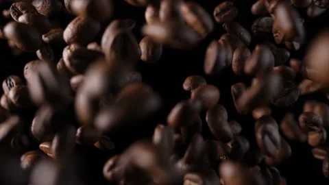 Roasted coffee beans in slow motion. Coffee beans in a free fall. Stock Footage 154208011