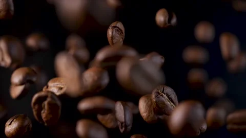 Roasted coffee beans in slow motion. Coffee beans in a free fall. Stock-Footage 154208043