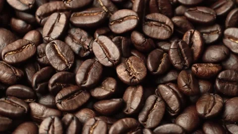 Roasted coffee beans, the smoke comes from the coffee beans. All elements will s 스톡 동영상 196684264