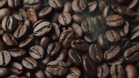 Roasted coffee beans, the smoke comes from the coffee beans. All elements will s 스톡 동영상 196684464