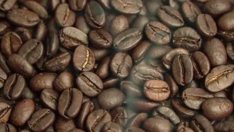 Roasted coffee beans, the smoke comes from the coffee beans. All elements will s 스톡 동영상 196684632