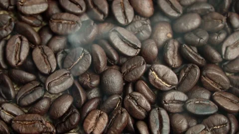Roasted coffee beans, the smoke comes from the coffee beans. All elements will s 스톡 동영상 196684673