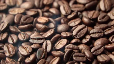 Roasted coffee beans, the smoke comes from the coffee beans. All elements will s 스톡 동영상 196684963