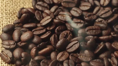 Roasted coffee beans, the smoke comes from the coffee beans. All elements will s 스톡 동영상 207174636