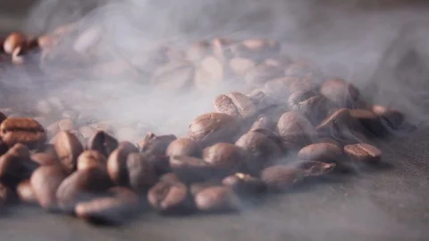 Roasted coffee beans with a smoke Stock Footage 101759710