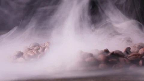 Roasted coffee beans with a smoke Stock Footage 101759725