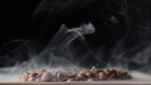 Roasted coffee beans with a smoke Stock Footage 101767805