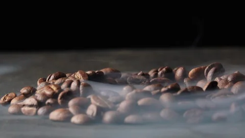 Roasted coffee beans with a smoke Stock Footage 101769564