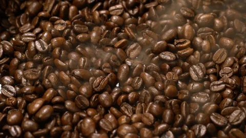 Roasted coffee beans with smoke Stock Footage 121587745
