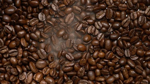 Roasted coffee beans with smoke Stock Footage 121640748