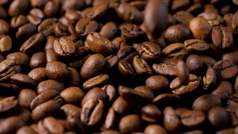 Roasted coffee beans. Smooth motion of arabica coffee seeds. Stock Footage 154206508