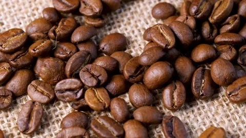 Roasted coffee beans. Smooth motion of arabica coffee seeds. Stock Footage 154206801