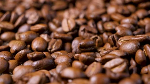 Roasted coffee beans. Smooth motion of arabica coffee seeds. Stock Footage 154206921