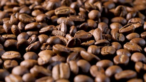 Roasted coffee beans. Smooth motion of arabica coffee seeds. Stock-Footage 154207136