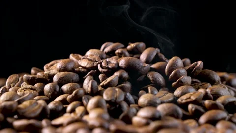 Roasted coffee beans. Smooth motion of arabica coffee seeds. Stock Footage 154207162