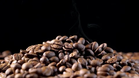 Roasted coffee beans. Smooth motion of arabica coffee seeds. Stock-Footage 154207207