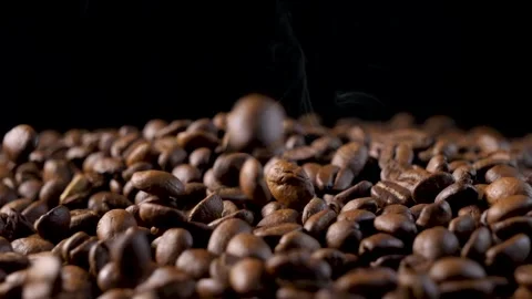Roasted coffee beans. Smooth motion of arabica coffee seeds. Video stock 154207226