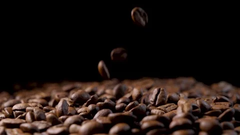 Roasted coffee beans. Smooth motion of arabica coffee seeds. Stock Footage 154207250