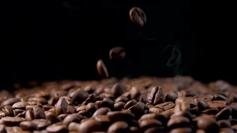 Roasted coffee beans. Smooth motion of arabica coffee seeds. Video stock 154207295
