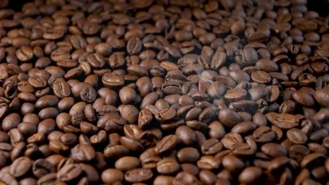 Roasted coffee beans. Smooth motion of arabica coffee seeds. Video stock 154207362