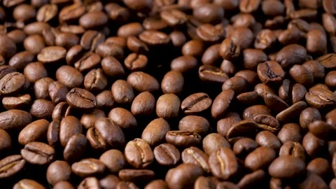 Roasted coffee beans. Smooth motion of arabica coffee seeds. Stock-Footage 154207382