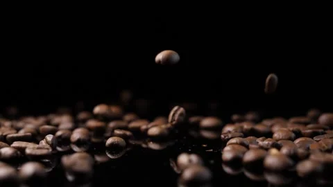 Roasted coffee beans. Smooth motion of arabica coffee seeds. Stock Footage 154207394