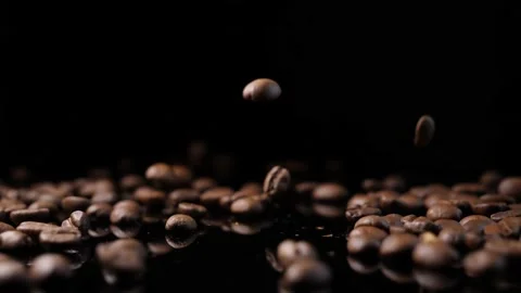 Roasted coffee beans. Smooth motion of arabica coffee seeds. Stock-Footage 154207410