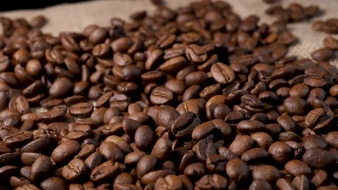 Roasted coffee beans. Smooth motion of arabica coffee seeds. Stock-Footage 154207452