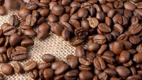 Roasted coffee beans. Smooth motion of arabica coffee seeds. Stock-Footage 154207690