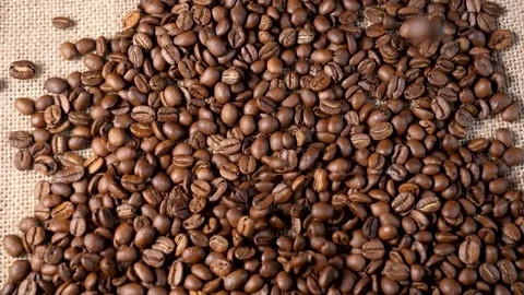 Roasted coffee beans. Smooth motion of arabica coffee seeds. Video stock 154207978