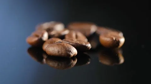 Roasted coffee beans spinning 4K Stock Footage 169128894