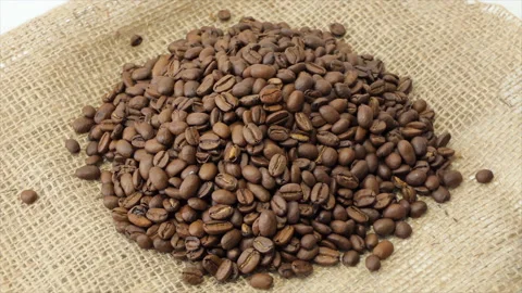 Roasted coffee beans spinning. 4K Stock Footage 195935676