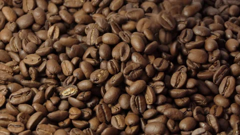 Roasted coffee beans spinning. 4K Stock Footage 195993295